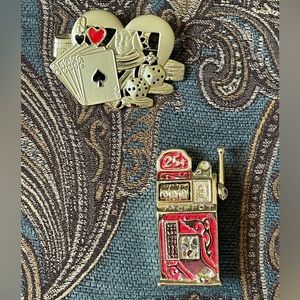 Gold tone brooches/ pins. Slot and cards with dice